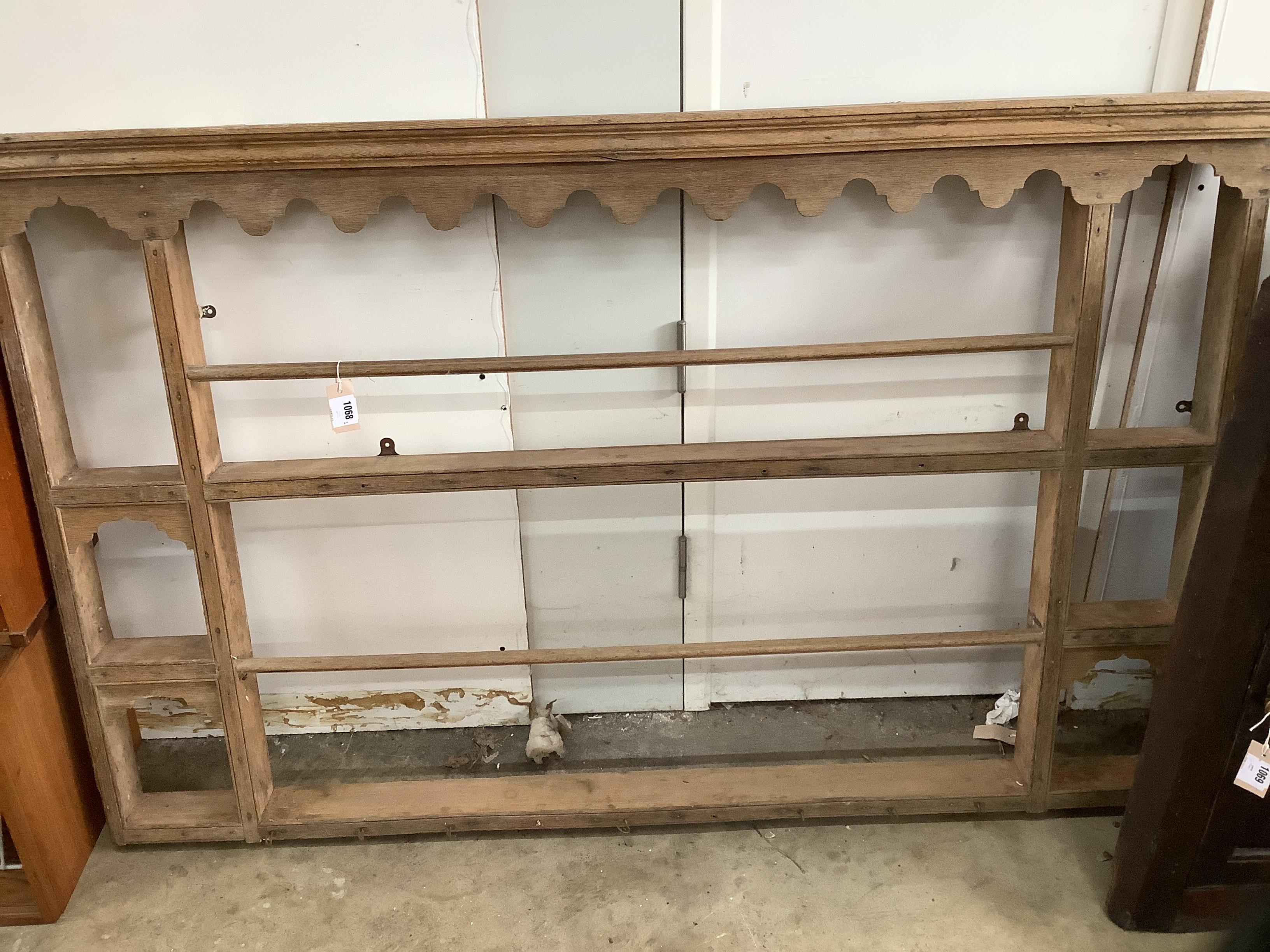 A 19th century pine plate rack, width 159cm, height 100cm